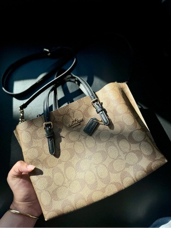 Coach Handbags - Coach Signature Canvas Tote in Brown with Black Handles.